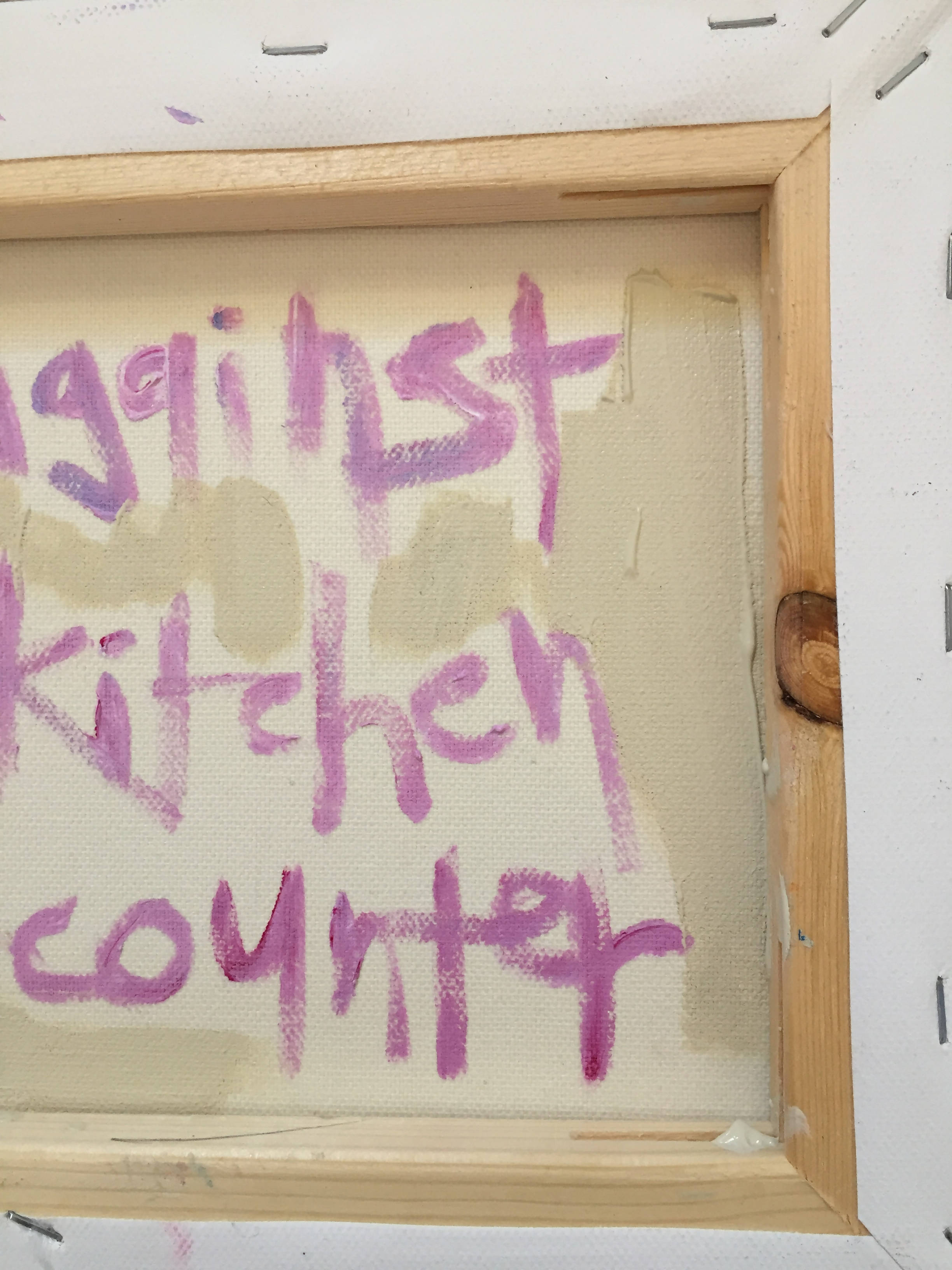 against the kitchen counter
