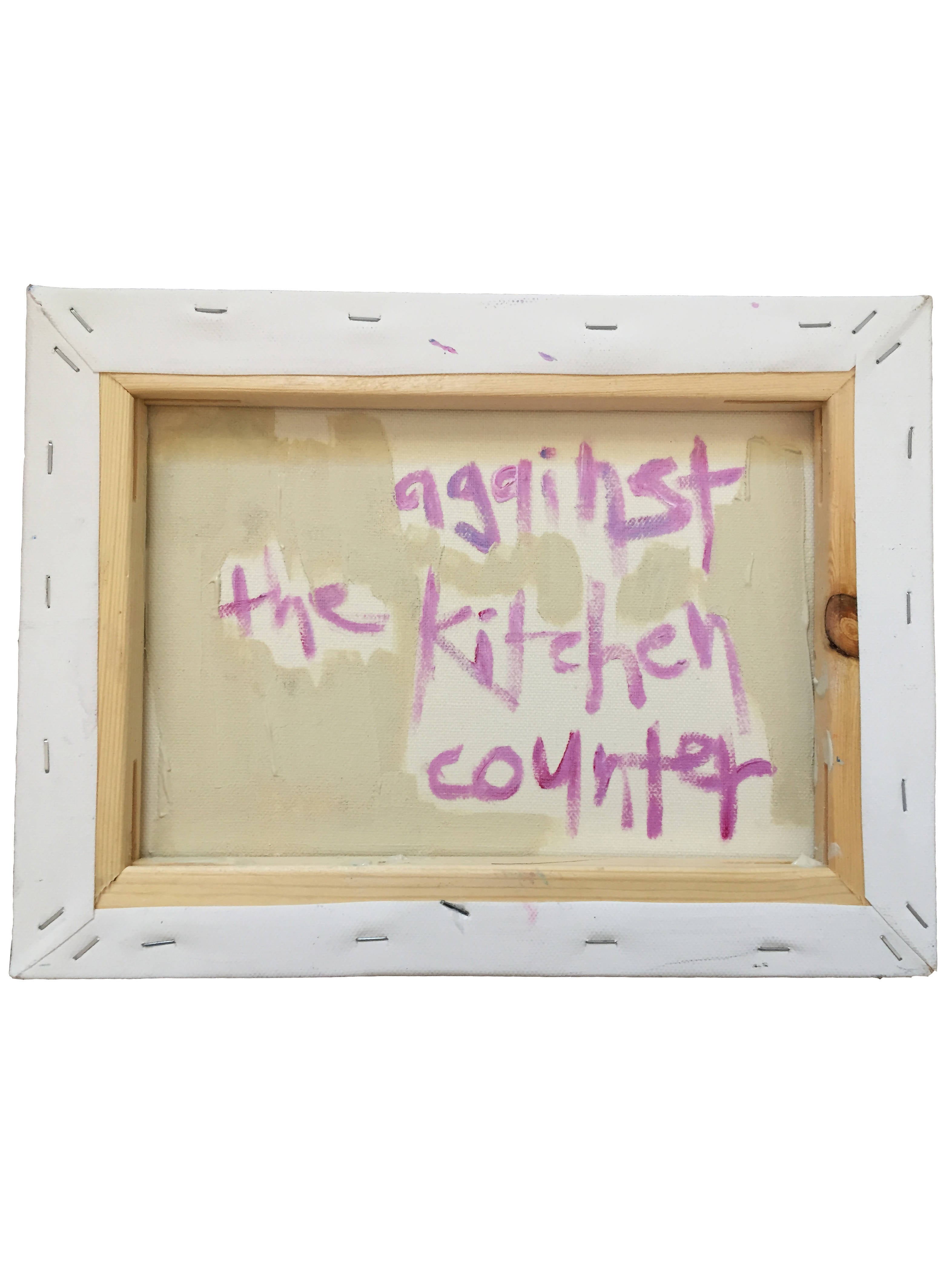 against the kitchen counter